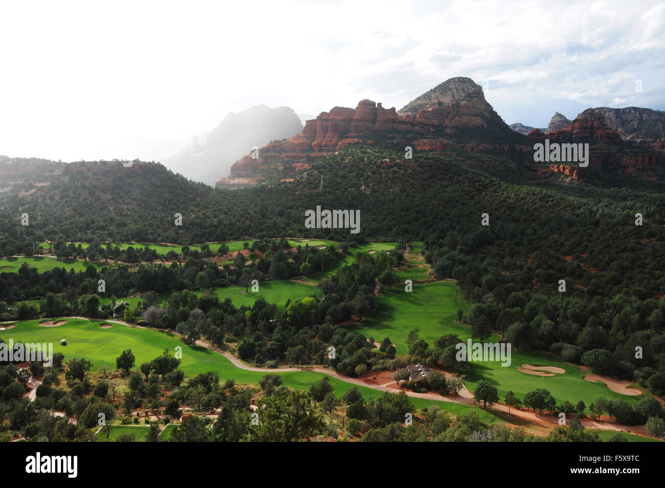 Light and clouds and rain above the Seven Canyons golf resort in Sedona, Arizona Stock Photo