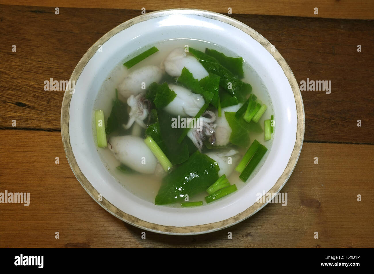 https://c8.alamy.com/comp/F5XD1P/plain-clear-soup-of-squid-stuffed-with-minced-pork-and-vegetable-F5XD1P.jpg