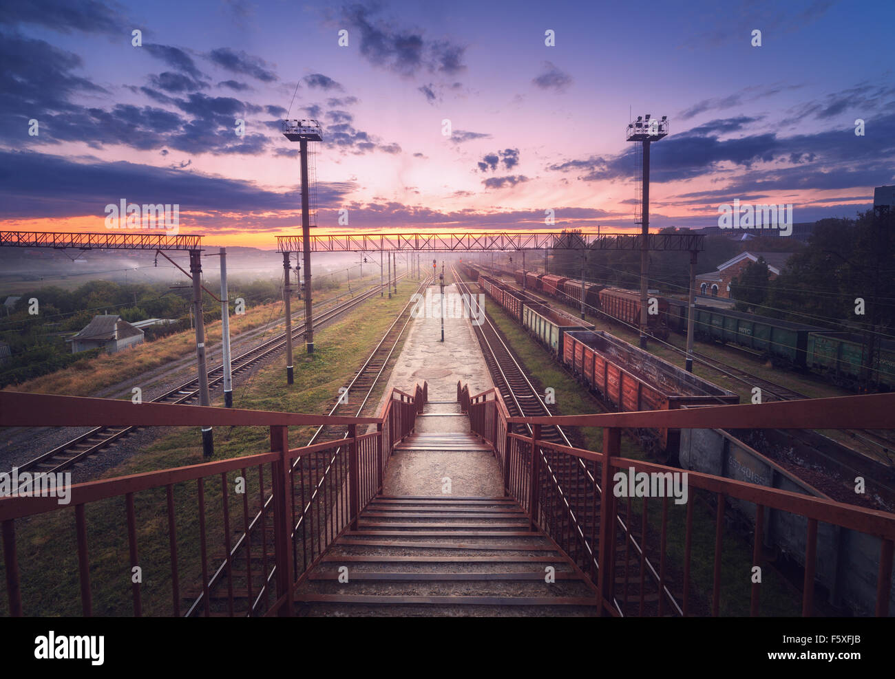 Cargo train platform at night. Railroad in Ukraine. Railway station