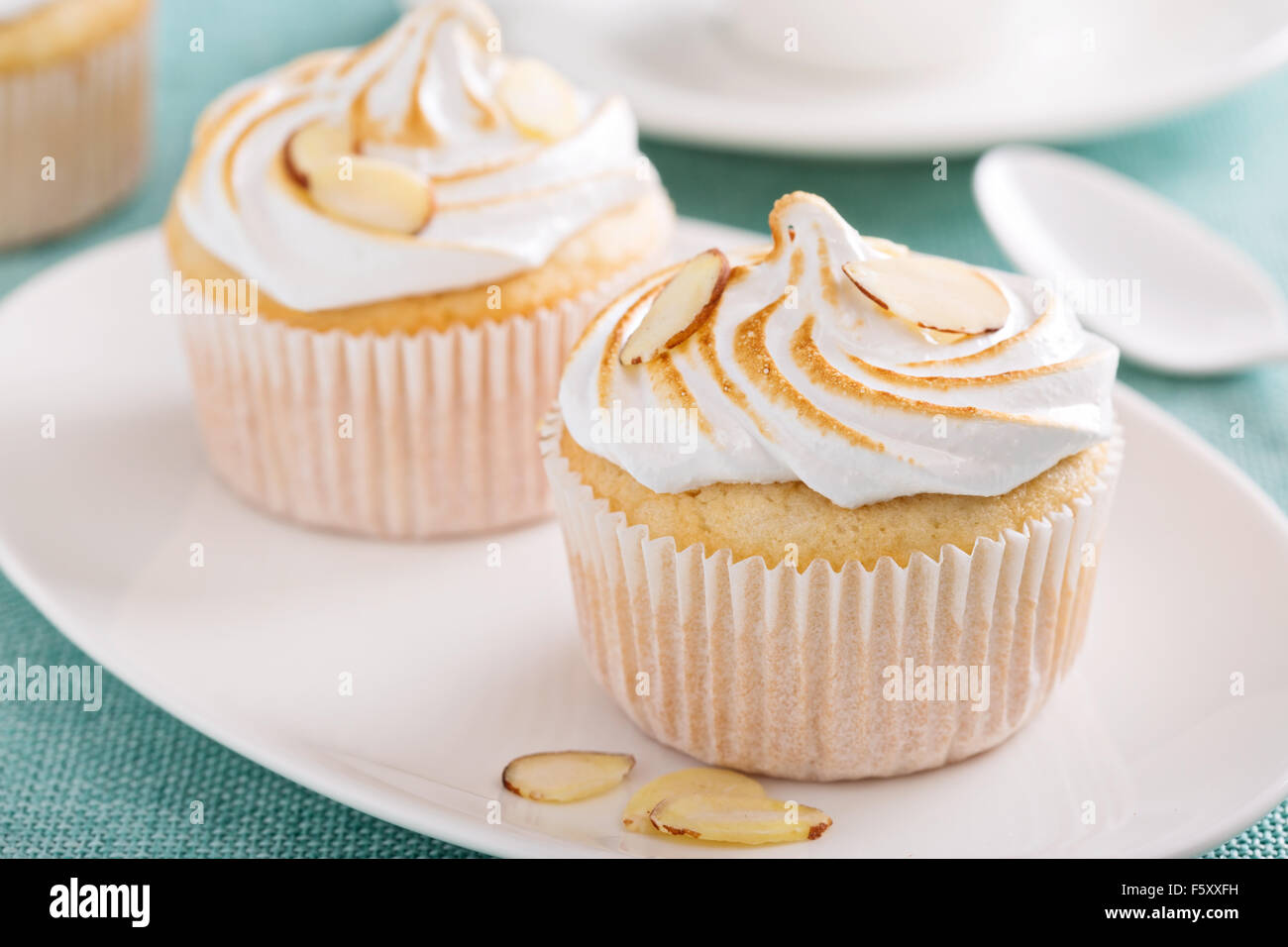 Almond cupcakes with meringue tops fluffy and light Stock Photo