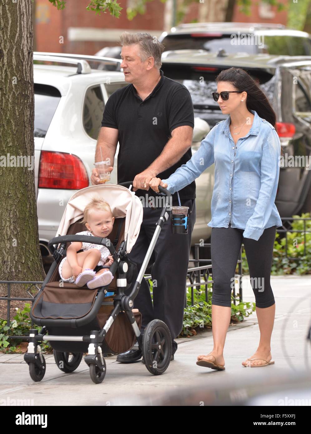 Alec Baldwin and wife Hilaria Baldwin take their daughter, Carmen, out for a stroll in SoHo  Featuring: Alec Baldwin, Hilaria Baldwin, Carmen Gabriela Baldwin Where: New York City, New York, United States When: 20 Sep 2015 Stock Photo