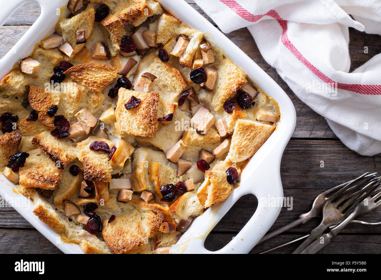 Bread pudding breakfast casserole with pear and dried cranberry Stock Photo