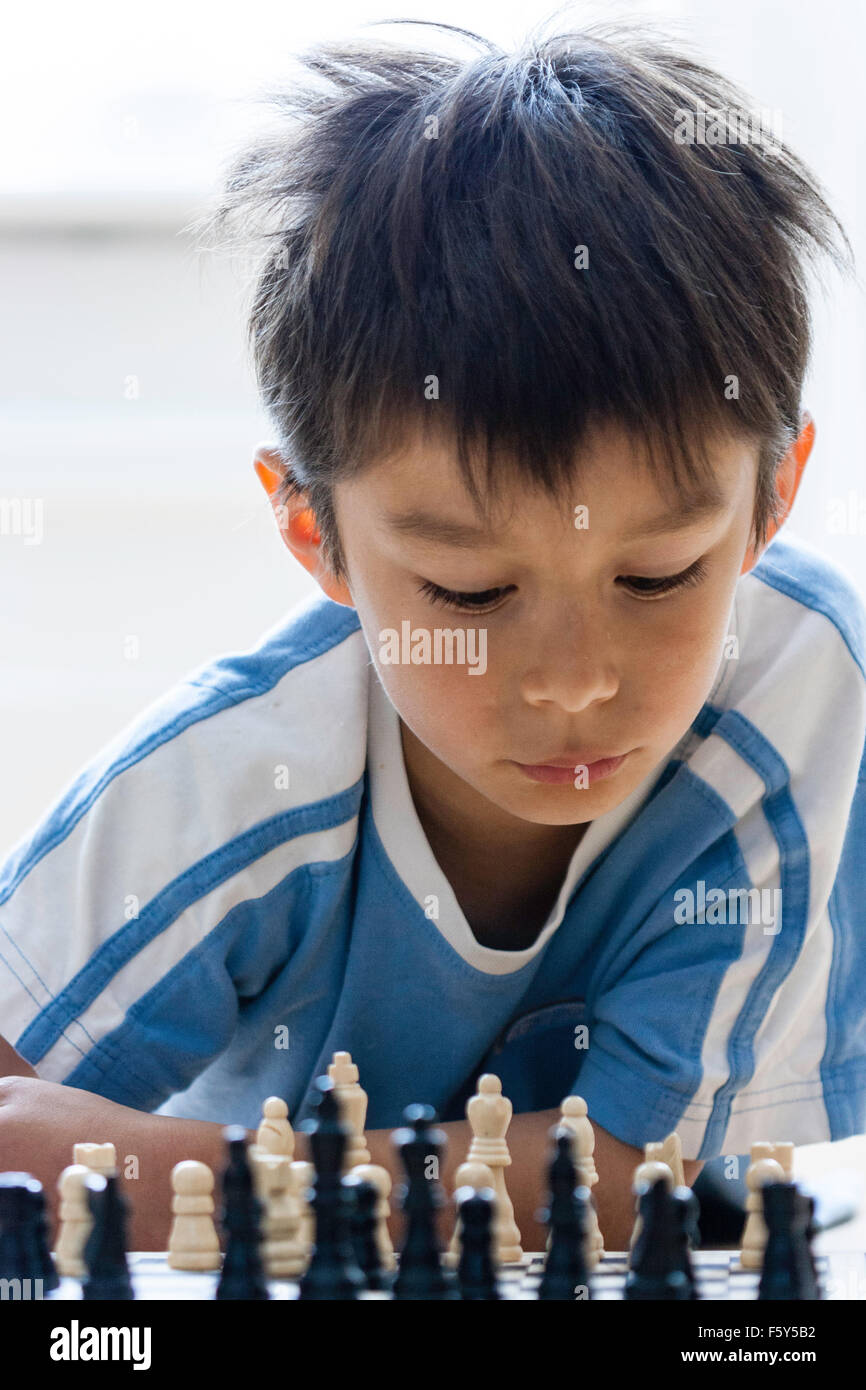 Sevenyearold Boy European Appearance Plays Chess Stock Photo