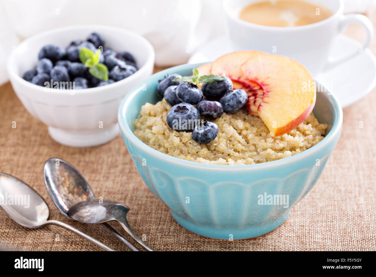 Breakfast quinoa porridge with fresh fruits in a bowl Stock Photo