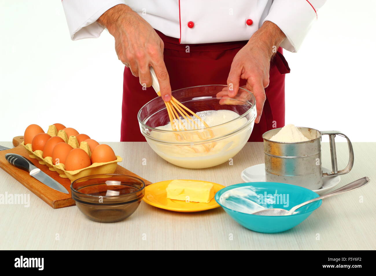 Whisking sugar with sour cream. Making bundt cake with chocolate glaze
