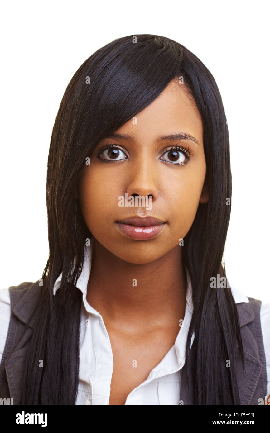 Young african woman looking seriously into the camera Stock Photo - Alamy