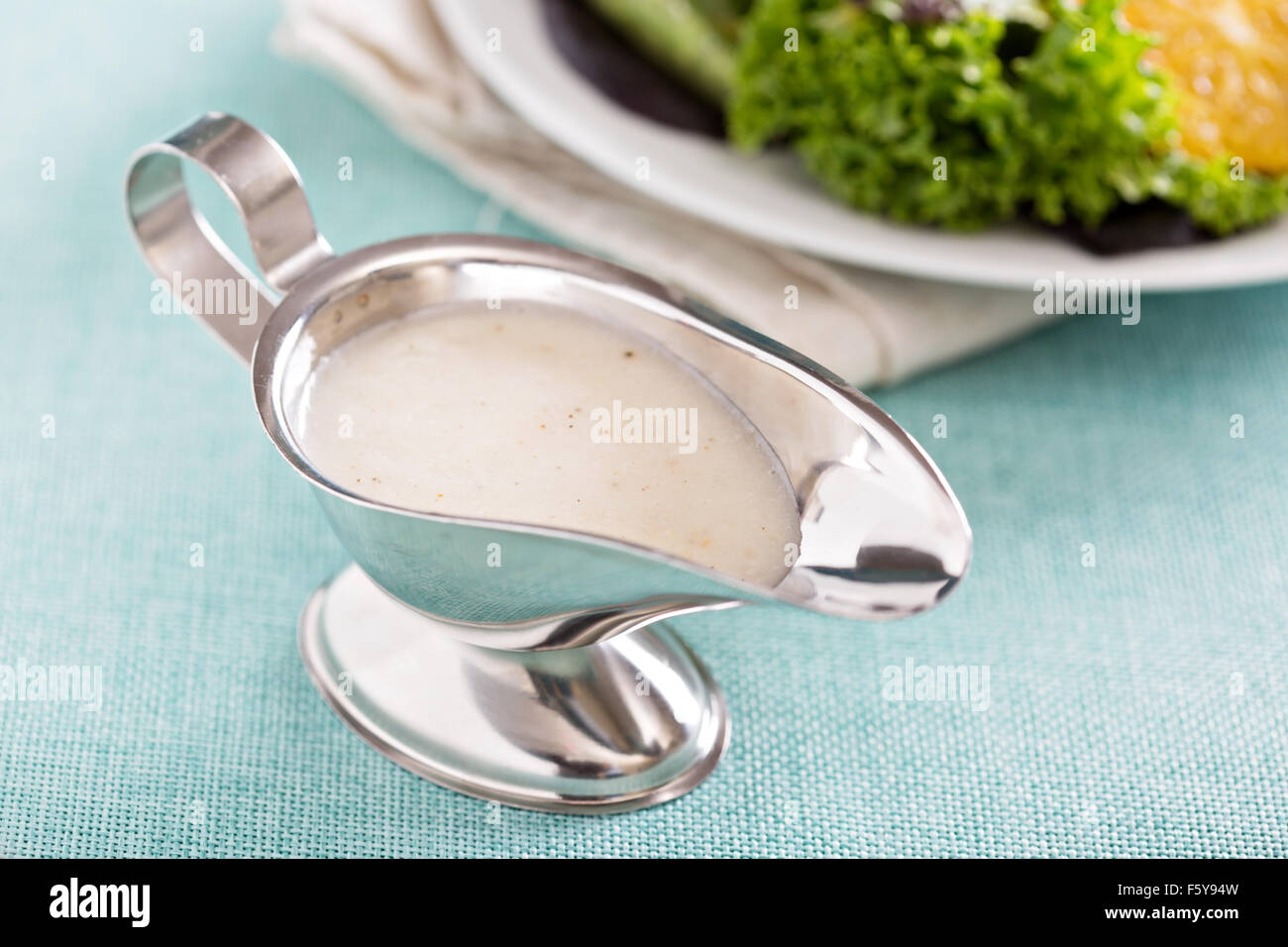 Creamy onion dressing in a small gravy dish Stock Photo Alamy