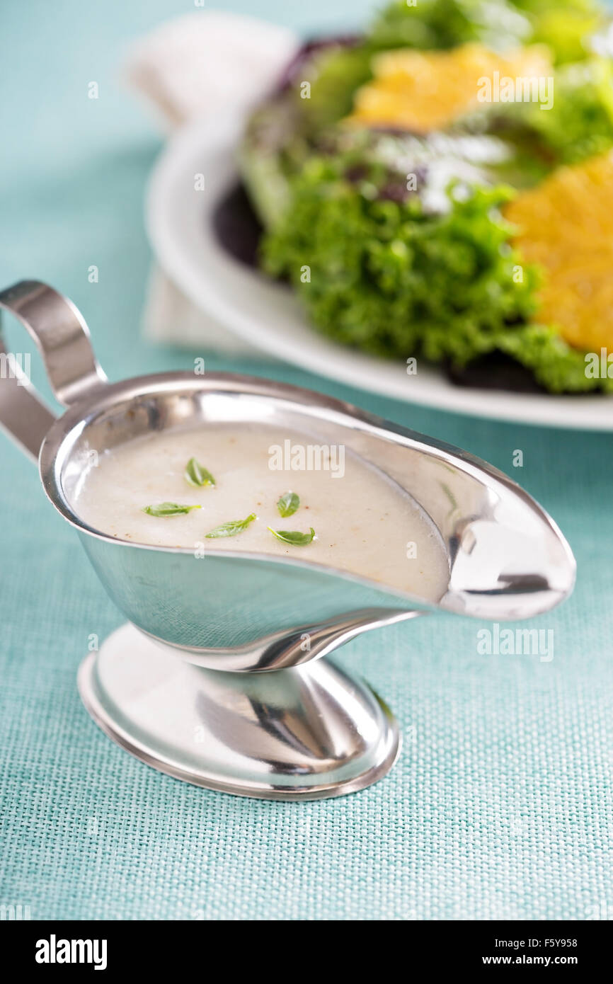 Creamy onion dressing in a small gravy dish Stock Photo Alamy