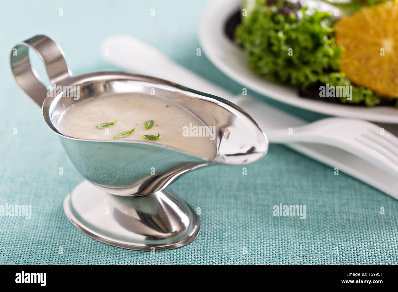 Creamy onion dressing in a small gravy dish Stock Photo Alamy