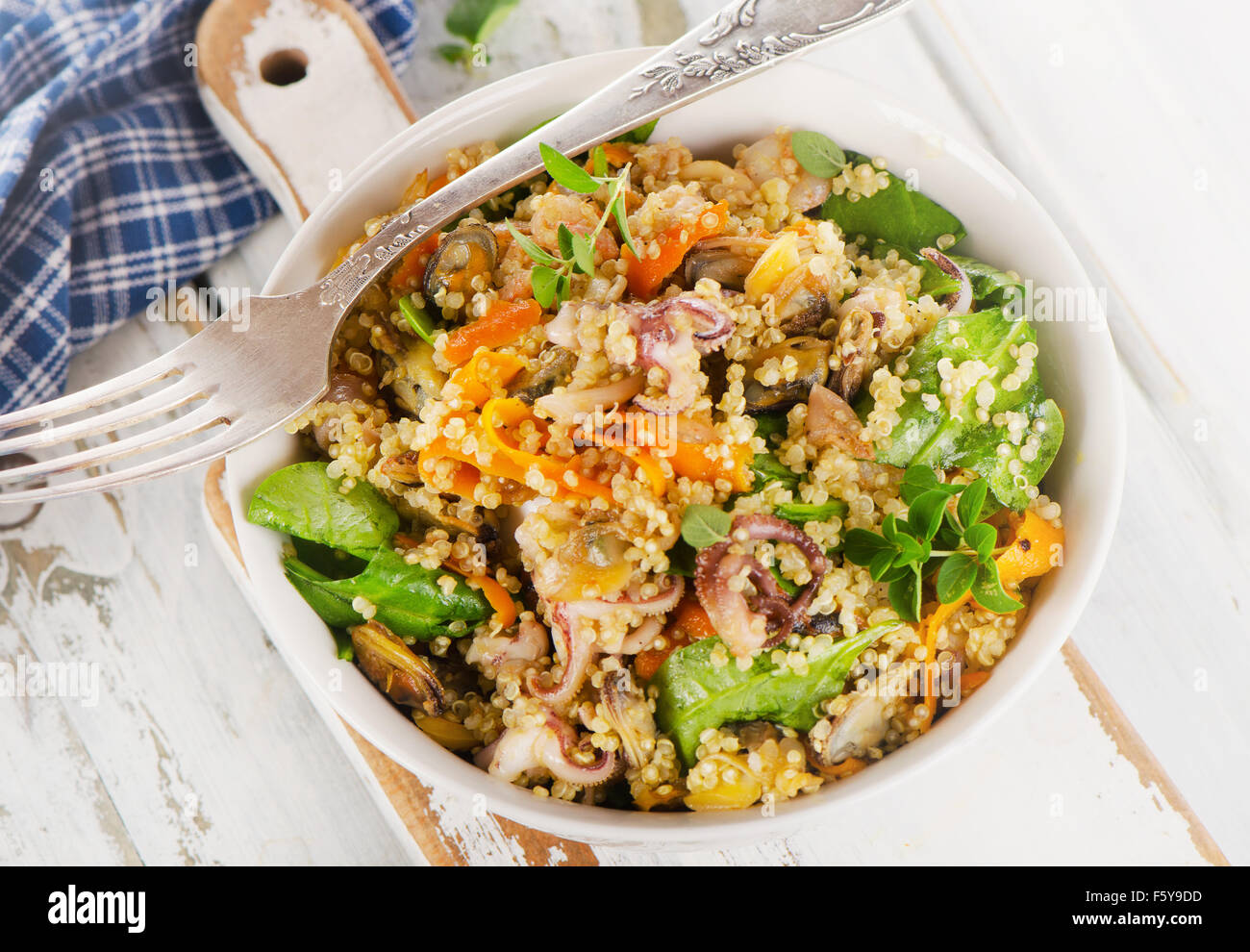Salad with quinoa and seafood in a bowl. Top view Stock Photo