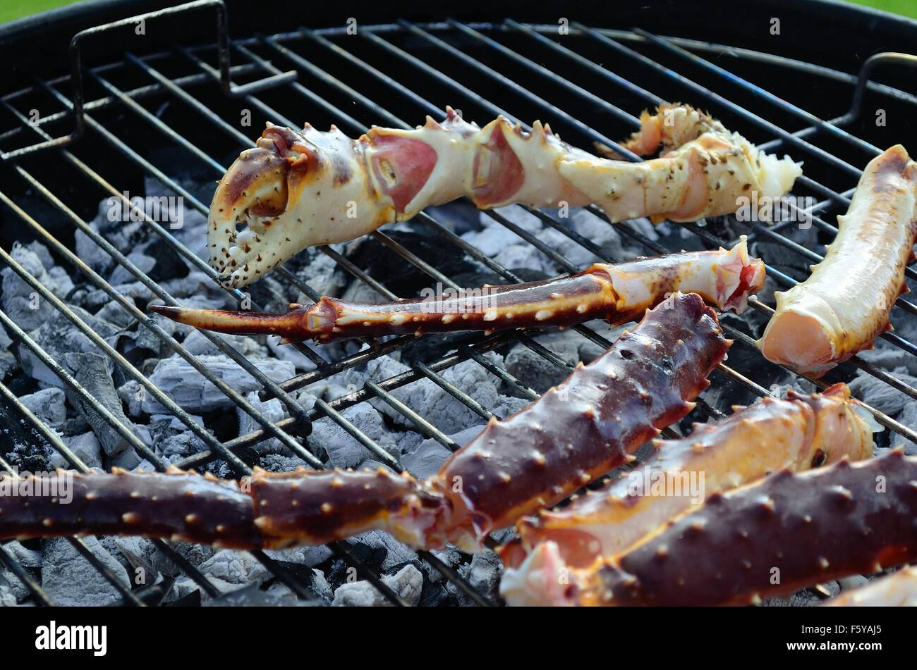 king crab legs on barbecue in summer Stock Photo Alamy