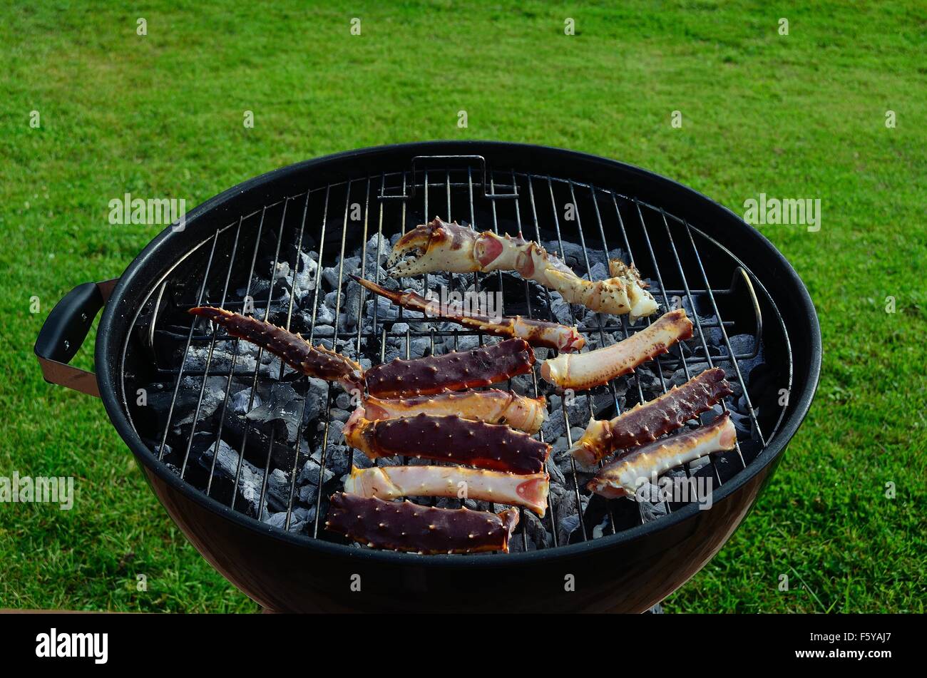 king crab legs on barbecue in summer Stock Photo Alamy