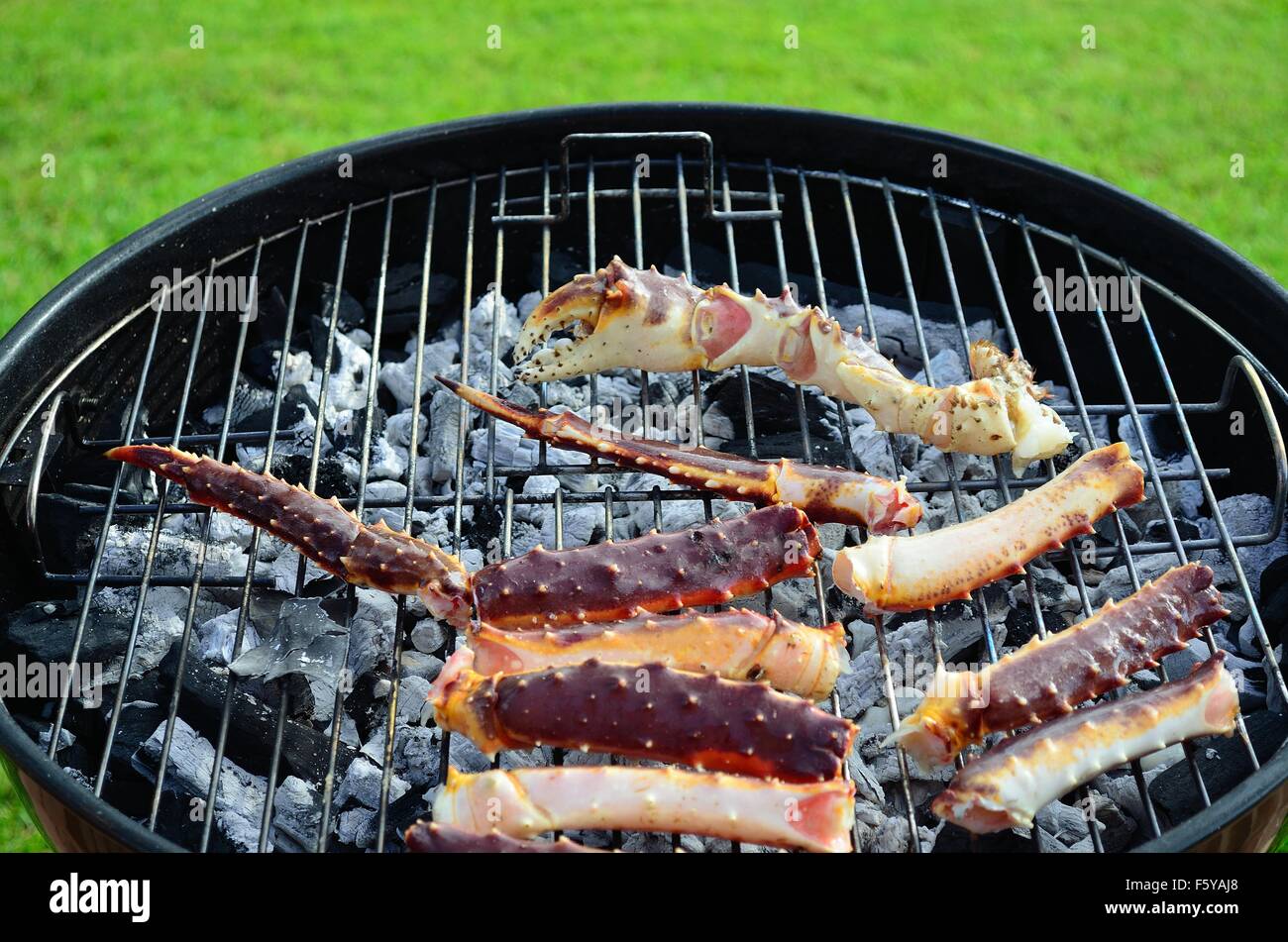 king crab legs on barbecue in summer Stock Photo Alamy