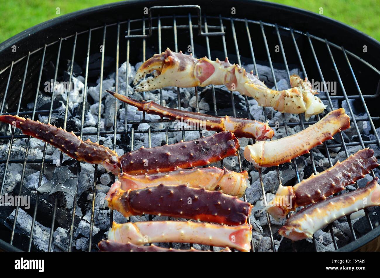 king crab legs on barbecue in summer Stock Photo Alamy