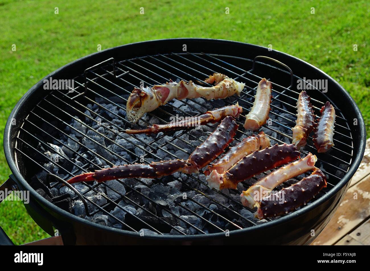 king crab legs on barbecue in summer Stock Photo Alamy