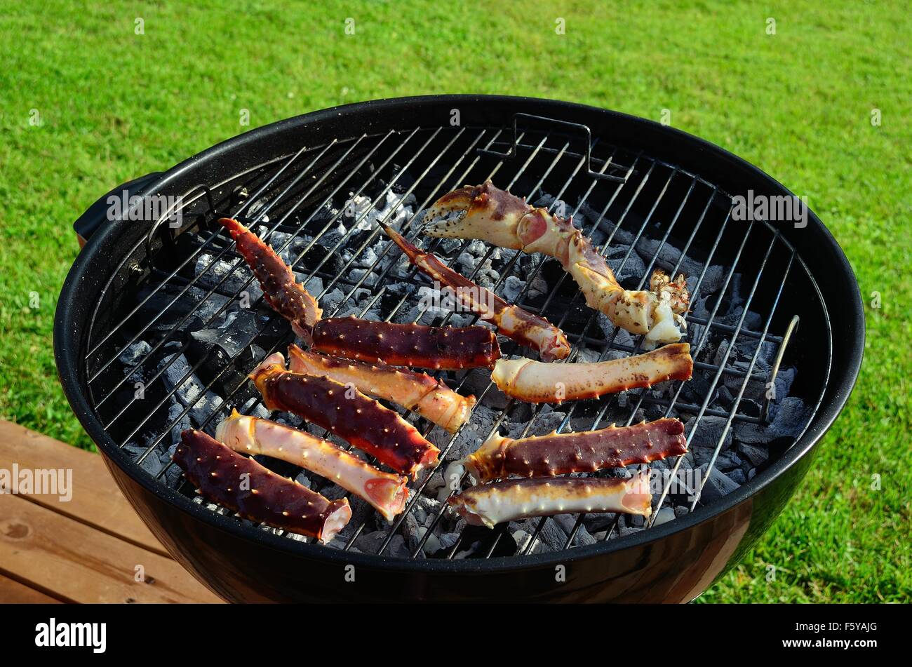 king crab legs on barbecue in summer Stock Photo Alamy