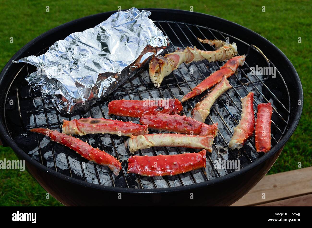 red delicious king crab leg on barbecue in summer Stock Photo