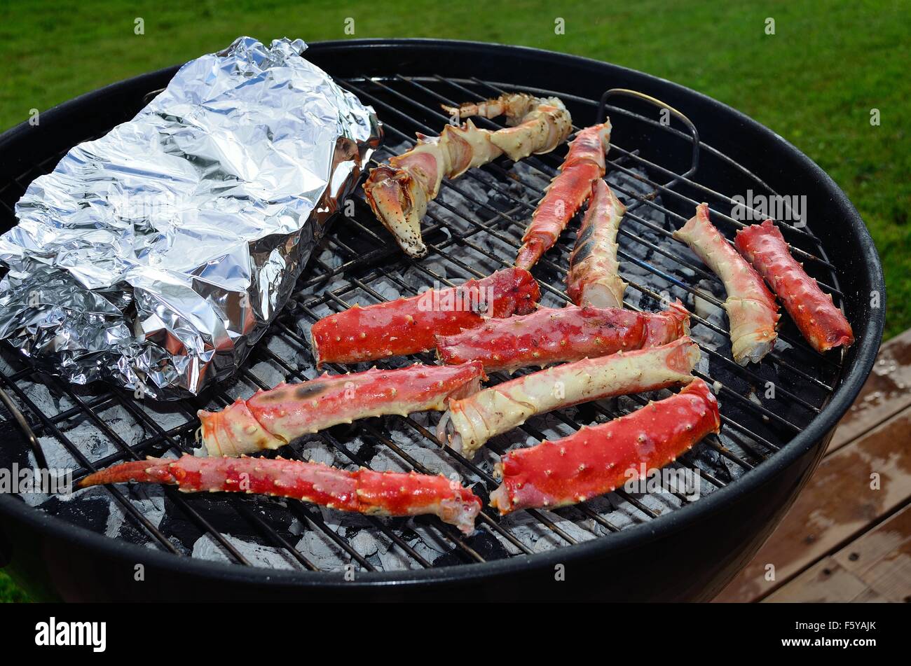 red delicious king crab leg on barbecue in summer Stock Photo