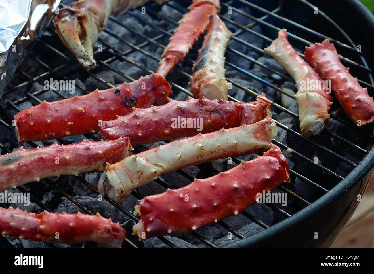 red delicious king crab leg on barbecue in summer Stock Photo