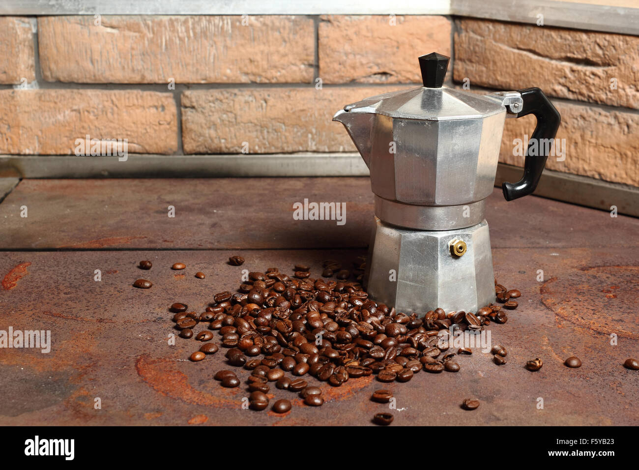 Moka pot and coffee beans Stock Photo Alamy