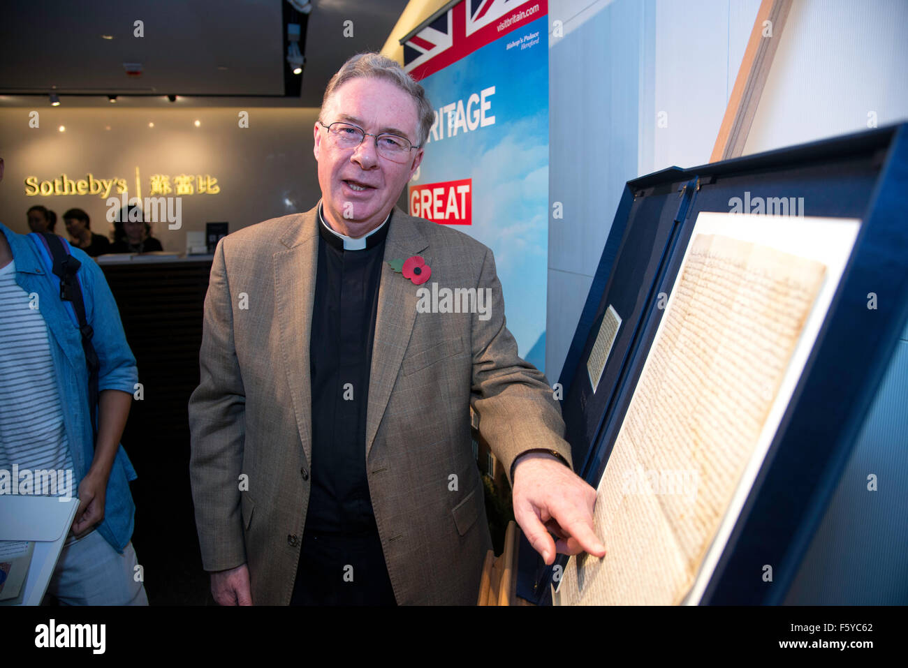 Hong Kong, China. 10th Nov, 2015. Hereford Cathedrals Chancellor Canon Chris Pullin.Magna Carta 800 Global tour comes to Hong Kong. Hereford Cathedral are exhibiting this 1217AD copy of the Magna Carta on a tour that takes in 9 countries including Hong Kong Credit:  Jayne Russell/Alamy Live News Stock Photo