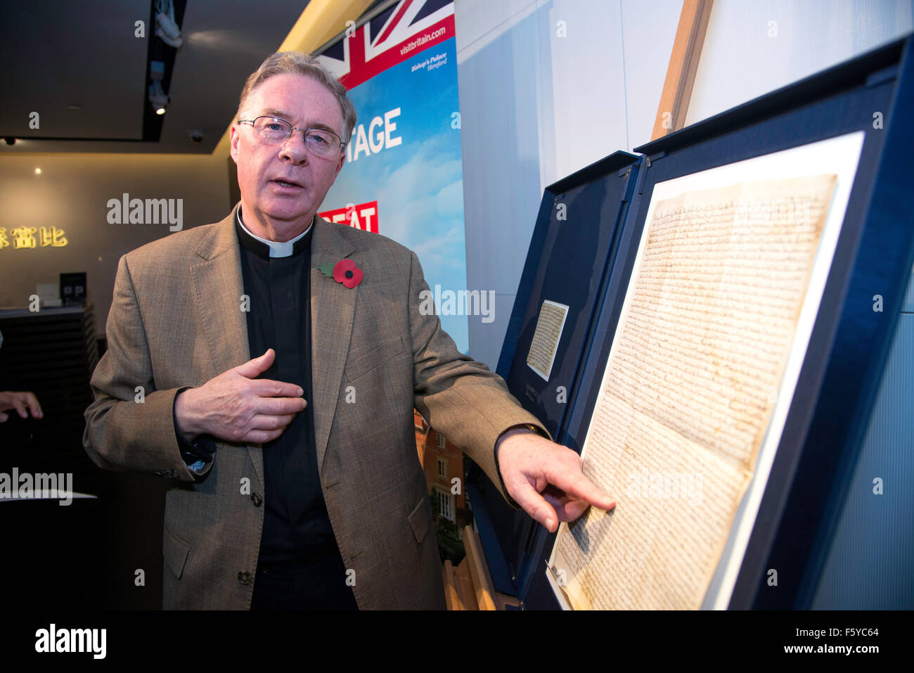 Hong Kong, China. 10th Nov, 2015. Hereford Cathedrals Chancellor Canon Chris Pullin.Magna Carta 800 Global tour comes to Hong Kong. Hereford Cathedral are exhibiting this 1217AD copy of the Magna Carta on a tour that takes in 9 countries including Hong Kong Credit:  Jayne Russell/Alamy Live News Stock Photo