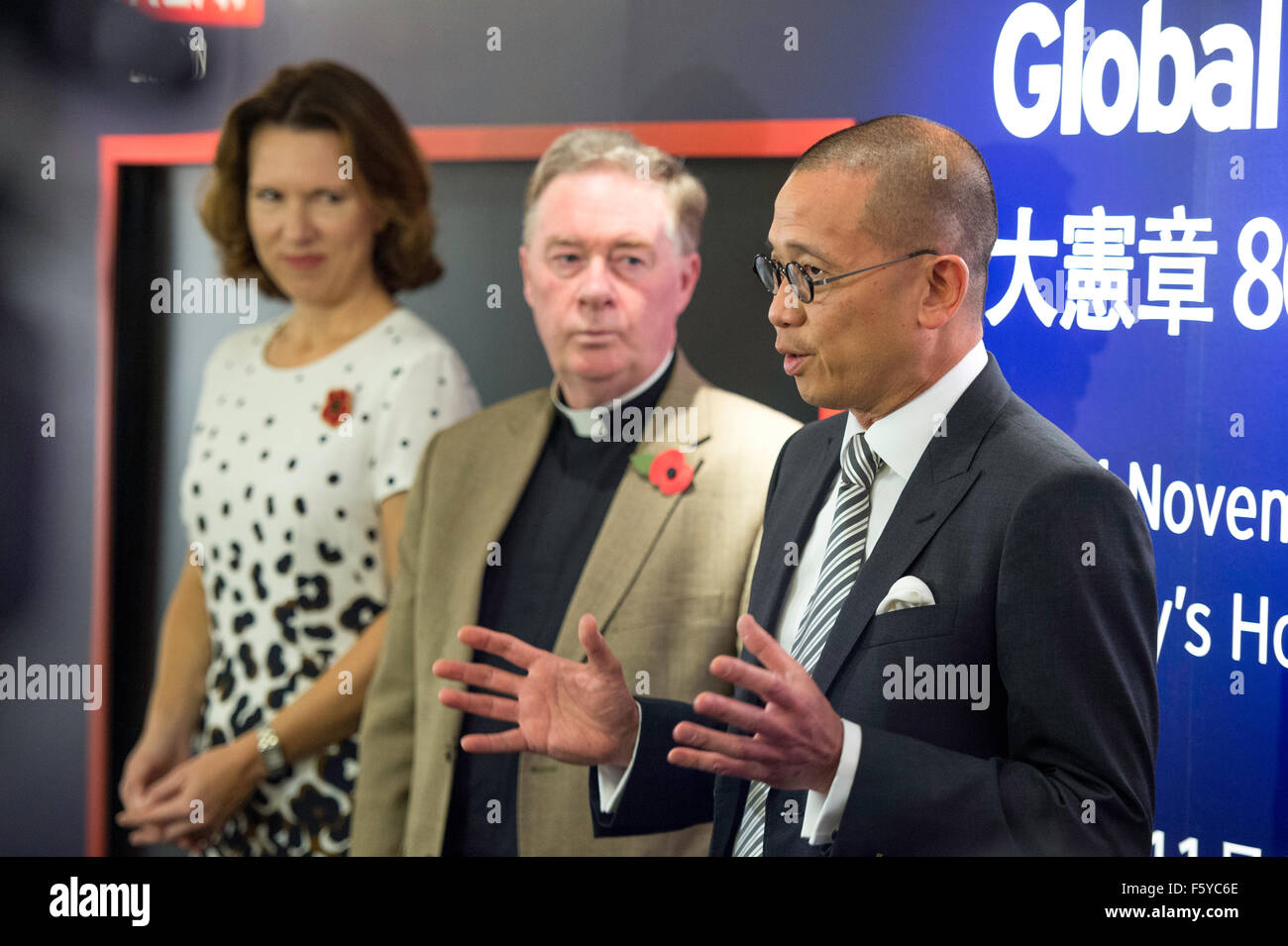 Hong Kong, China. 10th Nov, 2015. Sotheby's Asia CEO Kevin Ching (R)welcomes media to the opening event along with British Consul-General Caroline Wilson (L)and Chancellor Canon Chris Pullin (R). Magna Carta 800 Global tour comes to Hong Kong. Hereford Cathedral are exhibiting this 1217AD copy of the Magna Carta on a tour that takes in 9 countries including Hong Kong Credit:  Jayne Russell/Alamy Live News Stock Photo