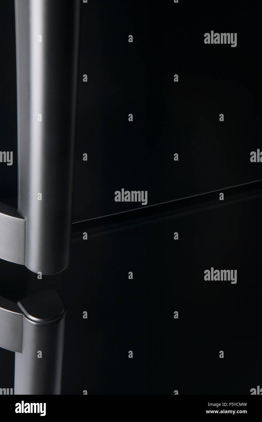 Refrigerator door handle low key vertical copy space Stock Photo Alamy