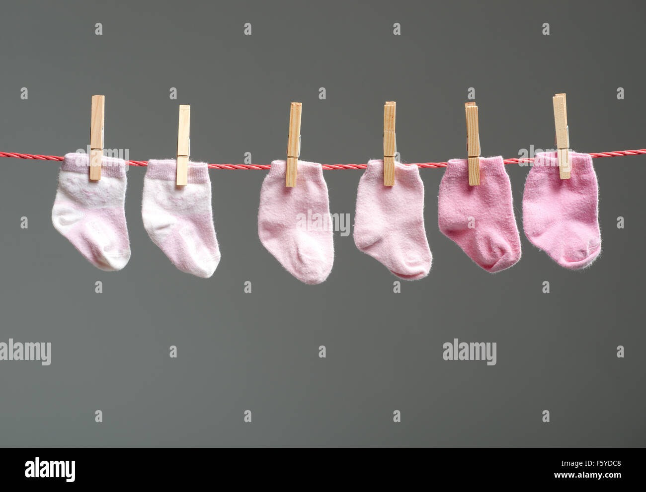 baby girl socks on the clothesline Stock Photo Alamy