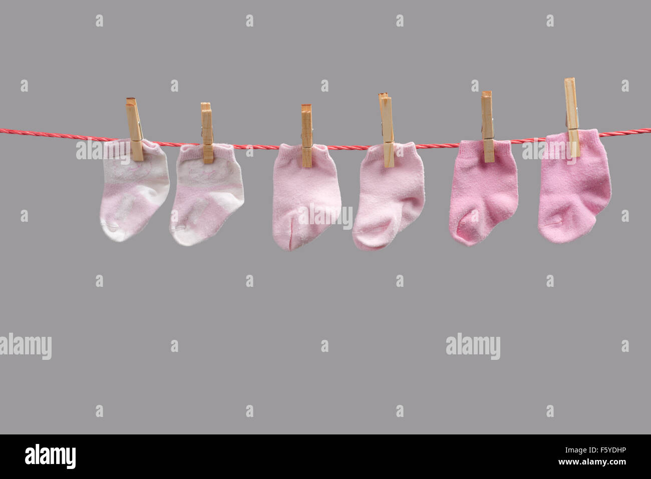 baby girl socks on the clothesline Stock Photo Alamy