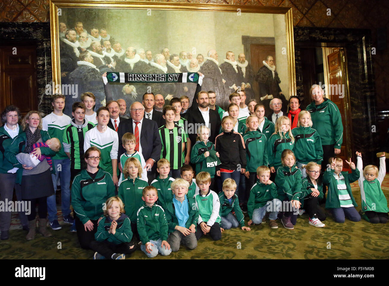 Former German soccer pro Uwe Seeler (C, L, with red tie) poses with the