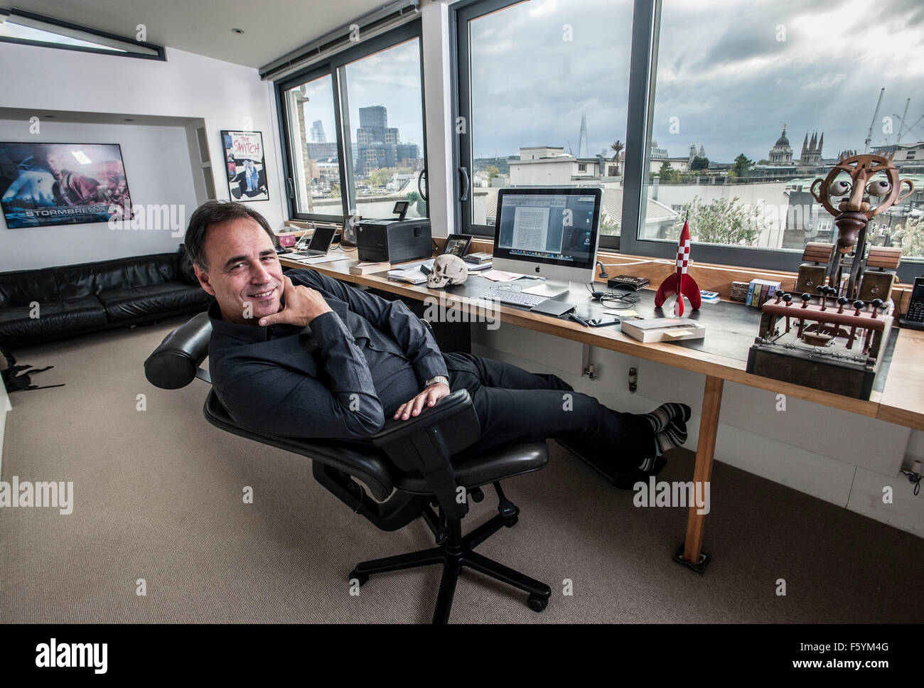 Writer Anthony Horowitz At Desk In His Home Office Stock Photo
