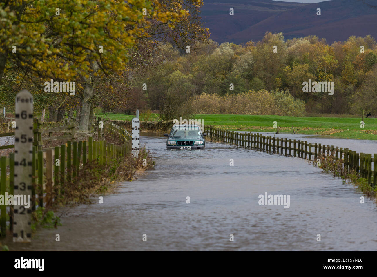 Skipton, North Yorkshire, UK. Tuesday 10th November 2015. Flood waters along the Aire Valley, just outside the North Yorkshire market town of Skipton, begin to recede after torrential rain hit the area on Monday. Several cars became stuck in the flood waters and local rail services between Skipton and Carlisle were halted. Credit:  Tom Holmes / TomHolmes.Photography / Alamy Live News Stock Photo