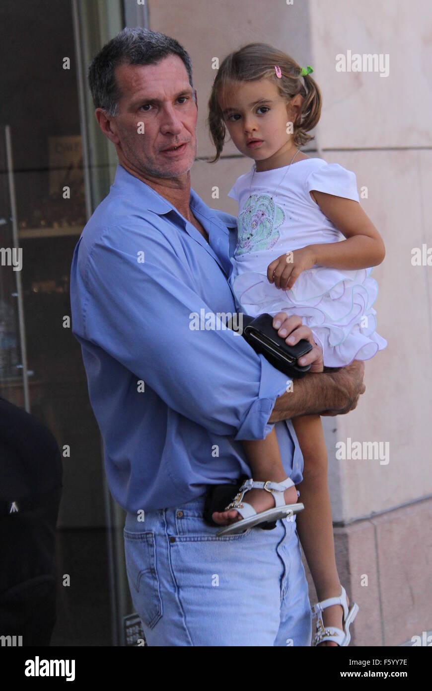 Andrea Bocelli picks up his 57th birthday cake at Il Pastaio with his wife Veronica Berti and their daughter Virginia  Featuring: Virginia Bocelli Where: Beverly Hills, California, United States When: 22 Sep 2015 Stock Photo