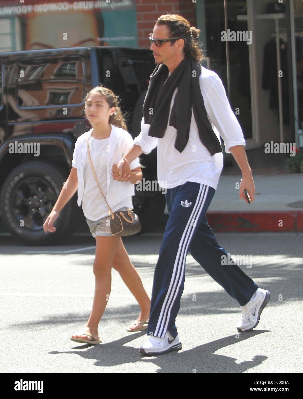 Soundgarden guitarist Chris Cornell takes his family to a nail salon in ...