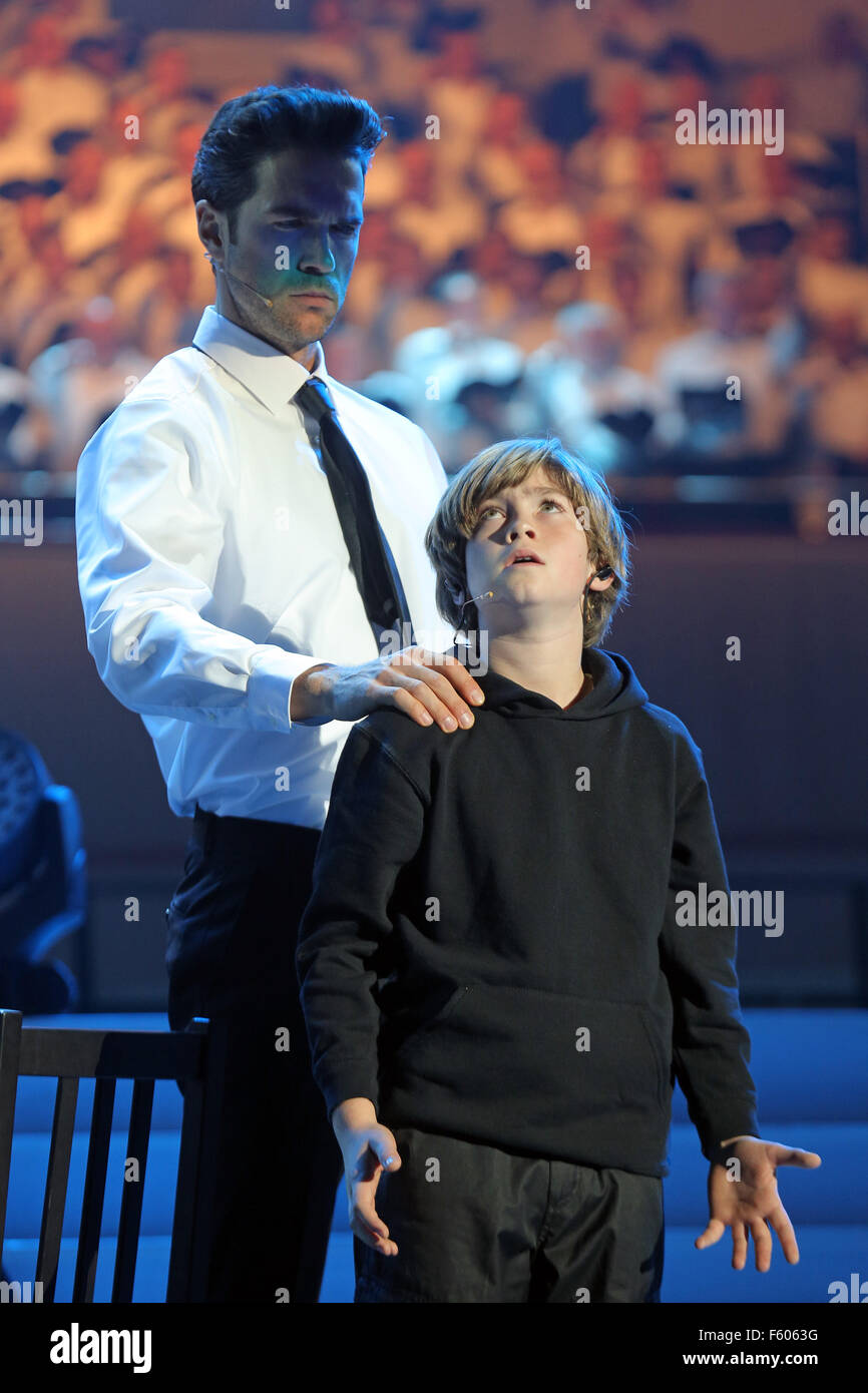 The Christian pop oratorio 'Luther' (Martin Luther as child (Giulio Riccitelli) and his father (Andreas Kammerzelt)) has been performed for the first time on stage on Reformation Day 31.Oct.2015 at the Westfallenhalle in Dortmund/Germany. Onstage the Westfalenhalle were 3,000 singers, also stars of the musical scene and a large symphony orchestra.  Libretto author Michael Kunze and composer Dieter Falk tell the struggle of the German church reformer Martin Luther (1483-1546) to the biblical truth and of its struggle against the authorities and the church. Stock Photo