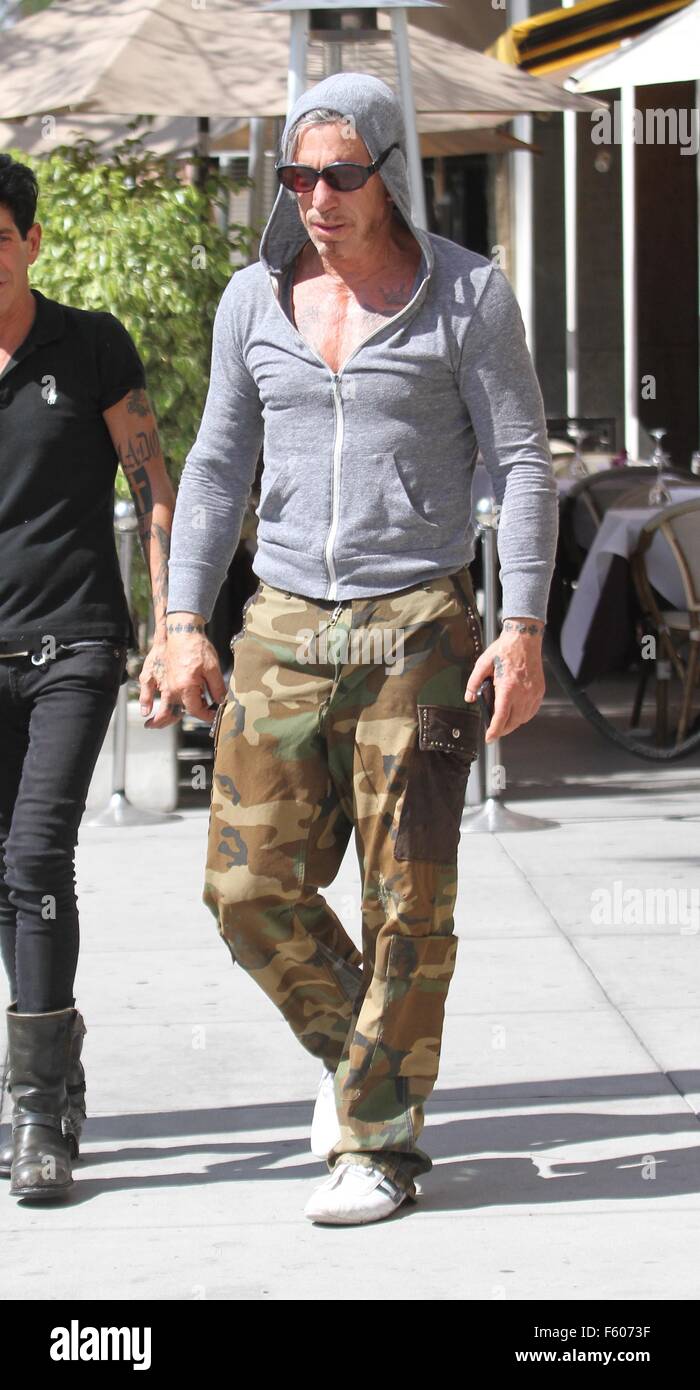 Mickey Rourke wearing a grey hoodie has lunch at Cafe Roma in Beverly ...