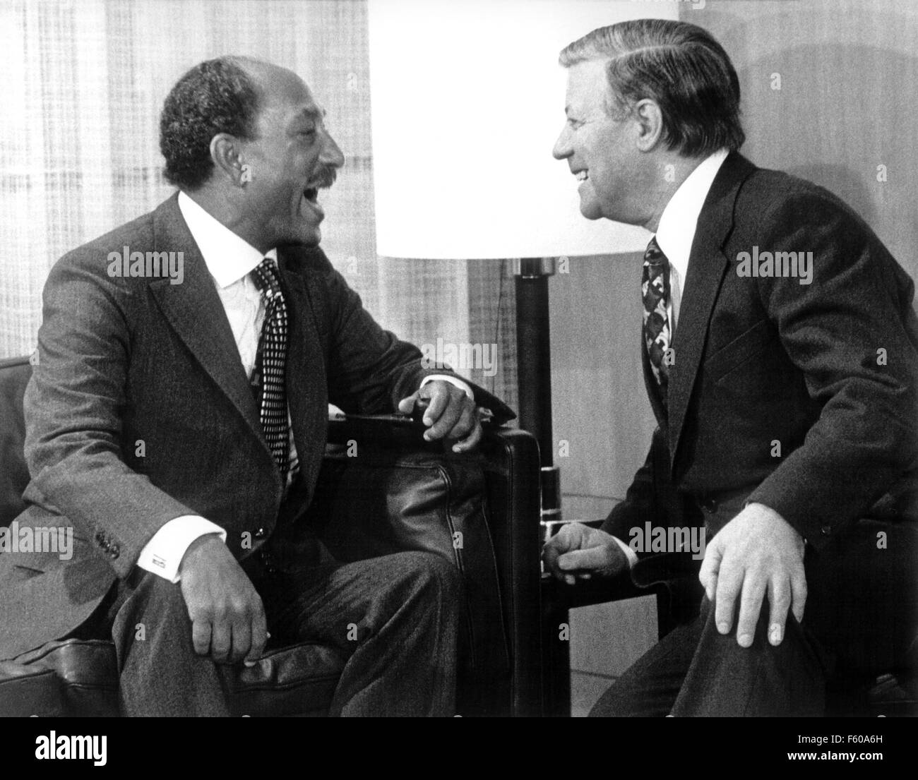 Egypt President Anwar el Sadat (l) was laughing together with German Chancellor Helmut Schmidt during their political talks on the second day of his visit in Bonn, on 1 April 1977. Stock Photo