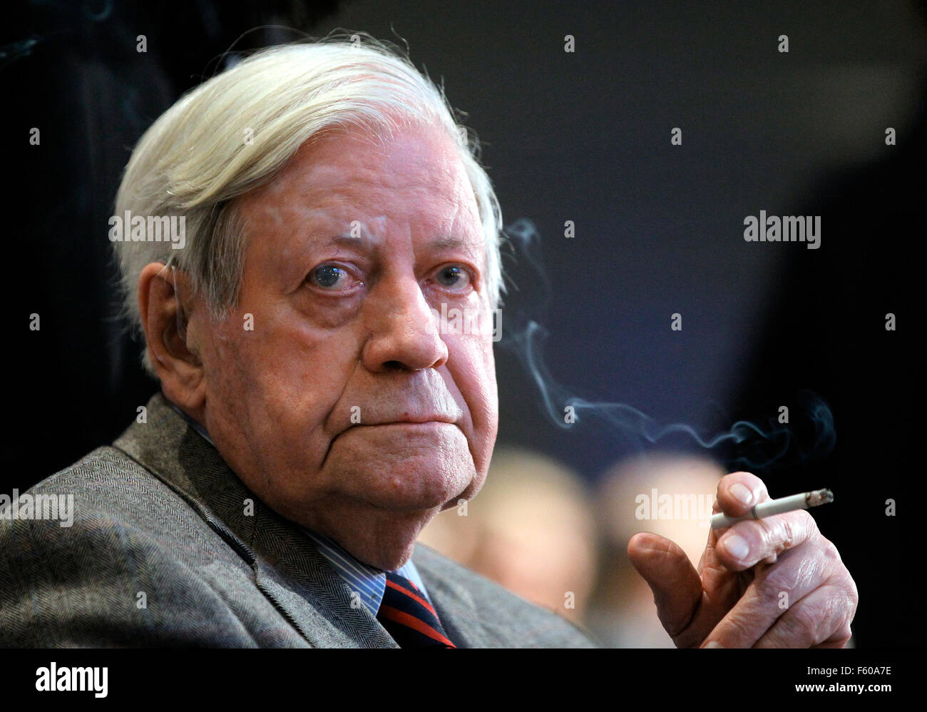 Former Chancellor Helmut Schmidt (SPD) smokes a cigarette at the 17th annual conference of the Deutsche Nationalstiftung at Axel Springer building in Berlin on 16 November 2010. Stock Photo