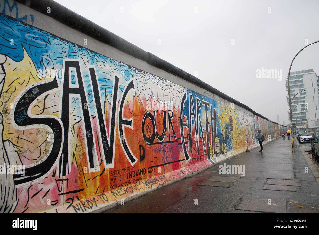 The Berlin Wall At The East Side Gallery Save Our Earth Graffiti Stock Photo Alamy