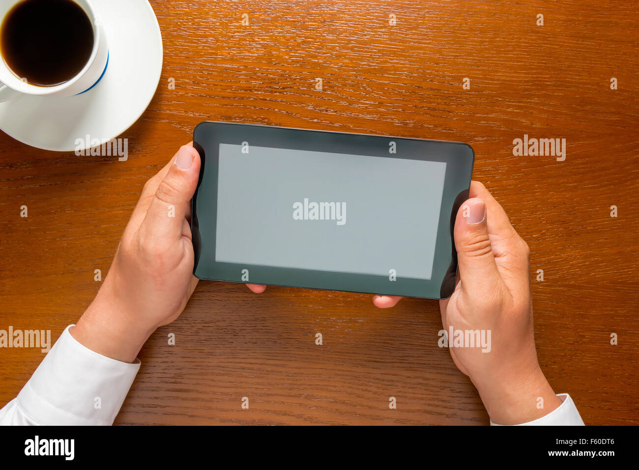 man holding in his hands tablet computer Stock Photo
