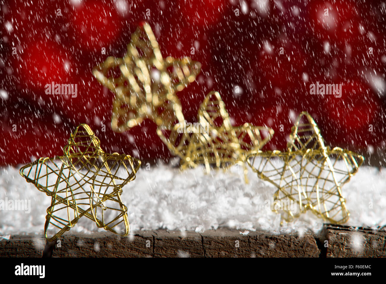Golden Christmas stars on the red background Stock Photo - Alamy