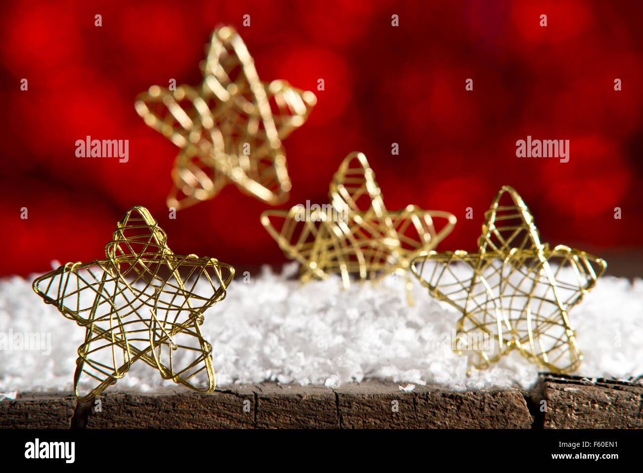 Golden Christmas stars on the red background Stock Photo - Alamy