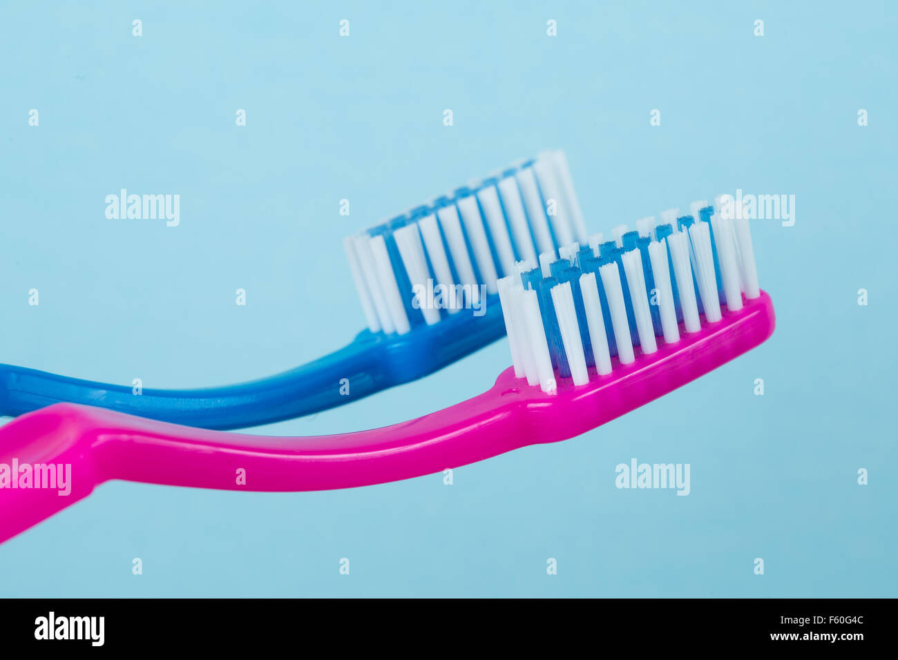 Two toothbrushes side by side. Stock Photo