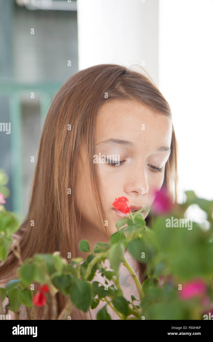 Young girl smelling the flowers Stock Photo - Alamy