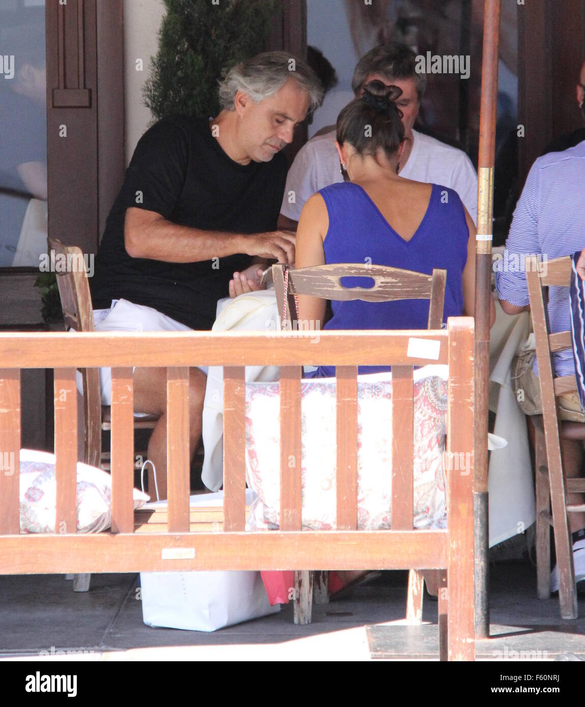 Andrea Bocelli receives a gift while eating lunch in Beverly Hills 