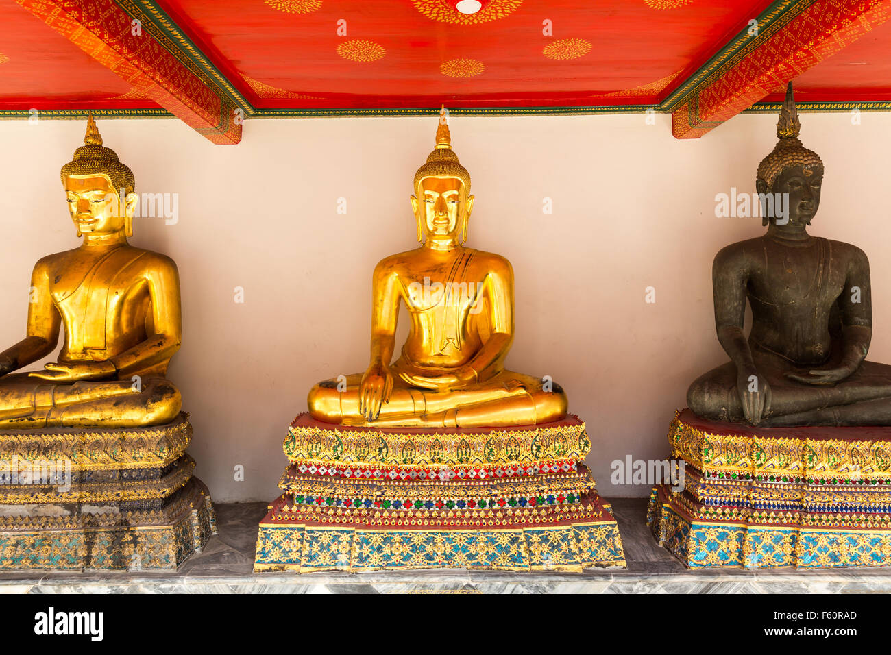 Set of Buddha statues against wall (Wat Po Temple) Stock Photo