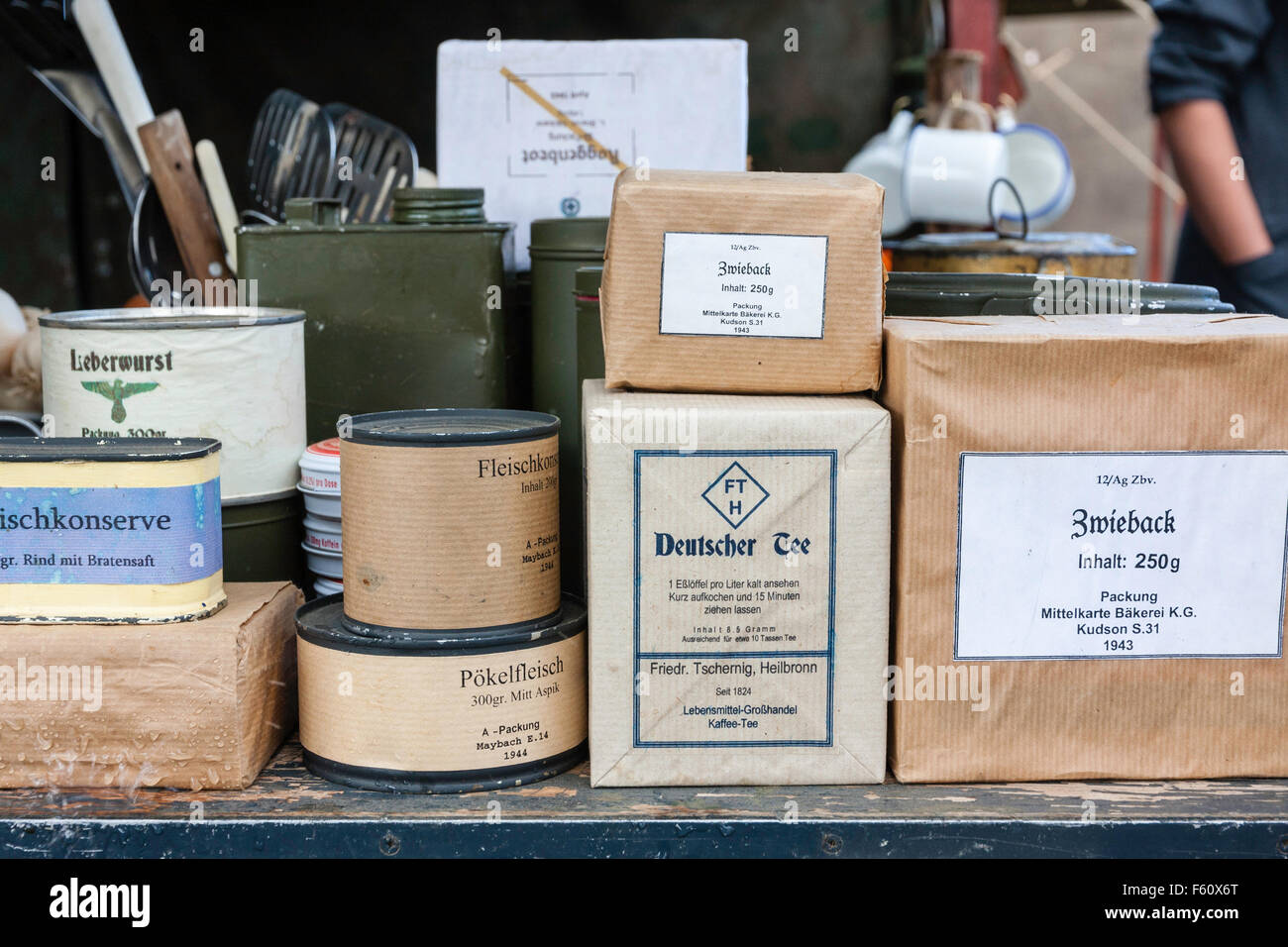 World War Two Re-Enactment. Display Of German Food Field Supplies, Packets And Cans Stacked With ...