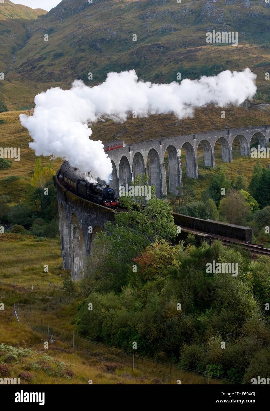 The Jacobite Steam Train passes over the Glenfinnan Viaduct Stock Photo