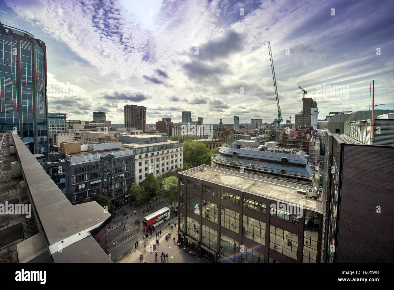 New developments and property renovations in Birmingham with a bus on